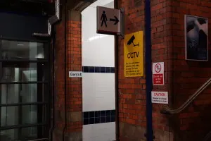 Camera Warning Outside Men's restroom