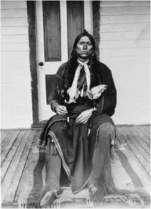 Quanah Parker seated on the porch of the Star House
